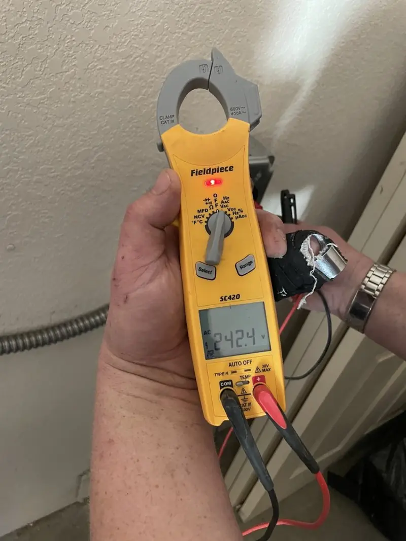 Voltage testing with clamp meter during Electrical Installation Services in Renton